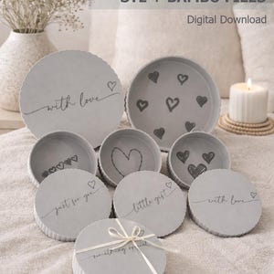 May include: A set of circular grey gift boxes with ribbed sides, featuring various heart illustrations and text including "with love," "just for you," "little gift," and "something special." The set is labelled as a digital download for STL and Bambu files.