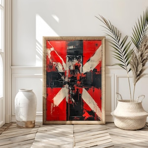 Pode incluir: Pintura abstrata em uma moldura de madeira com pinceladas vermelhas, brancas e pretas. A pintura está pendurada em uma parede branca com uma planta em uma cesta em primeiro plano.