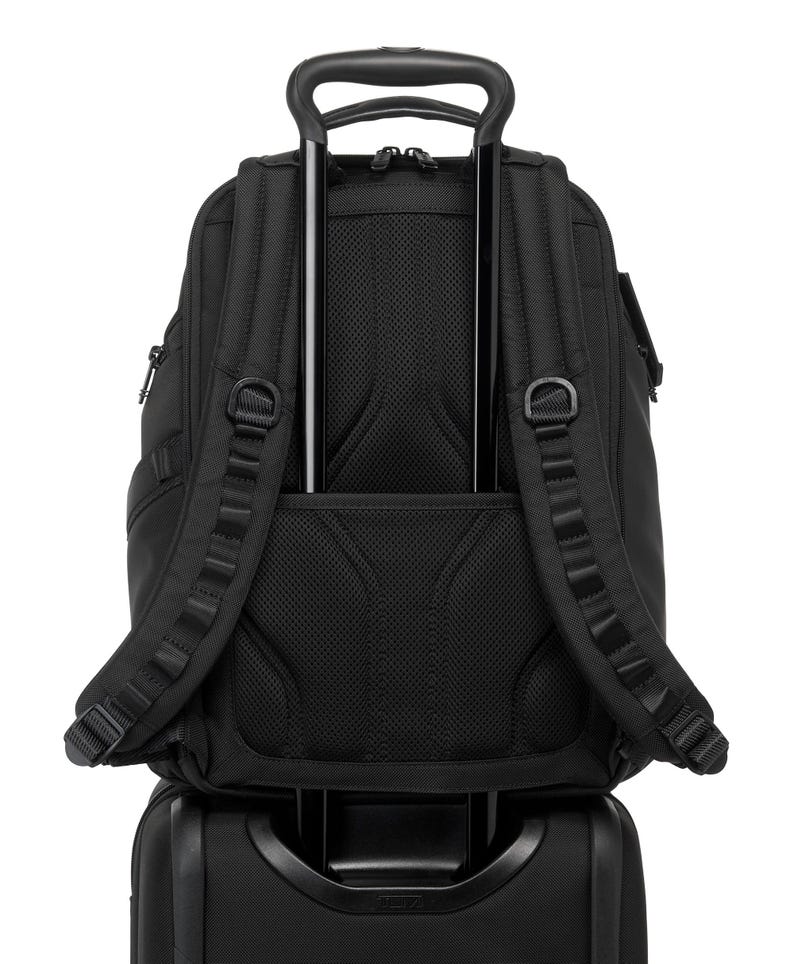 May include: A black backpack with a telescoping handle, attached to a rolling suitcase. The backpack has padded shoulder straps, multiple compartments, and a mesh back panel for ventilation. The handle is extended, ready for travel.
