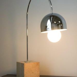 Harvey Guzzini Arc Chrome and Travertine Table Lamp