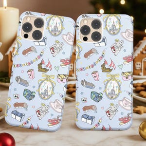 May include: Two light blue phone cases with a repeating pattern of a castle, an elephant, a teacup, a boat, and other whimsical illustrations. The phrase "Best Day Ever" is written on a banner.