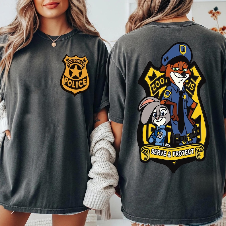 May include: Dark grey t-shirts with a Zootropolis Police badge on the front and a cartoon image of Nick Wilde and Judy Hopps on the back. The back graphic includes the text "Zootropolis Police" and "Serve & Protect".