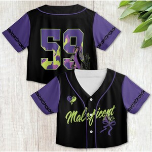 May include: Two black and purple baseball jerseys with a dragon and the word "Maleficent" printed on them. The jersey on the left has the number "59" printed on the back.