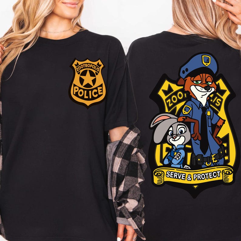 May include: Black t-shirt with a Zootropolis Police badge on the front and a larger graphic on the back. The back graphic features Nick Wilde and Judy Hopps in police uniforms, with the words "Zootropolis" and "Serve & Protect".