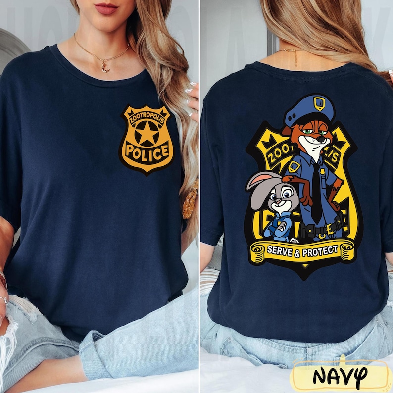 May include: Navy blue t-shirt with a Zootropolis Police badge on the front and a graphic of Nick Wilde and Judy Hopps on the back. The back graphic includes the text "Zootropolis Police" and "Serve & Protect".