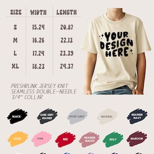 May include: A cream-coloured youth t-shirt with the text "YOUR DESIGN HERE" in black. The shirt's size chart shows widths from 38.7 to 46.3 cm and lengths from 53 to 61.9 cm. Available colours include black, grey, navy, and more.