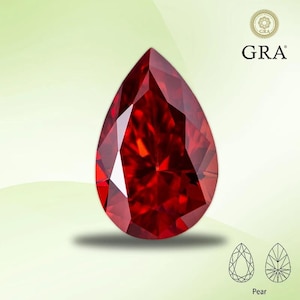 May include: A faceted, pear-shaped, deep red gemstone. The gem has a brilliant cut, reflecting light. The image includes the GRA logo and a diagram of the gem's cut. The gem is set against a light green background.