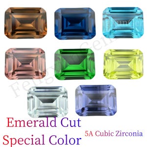 May include: Assortment of emerald cut cubic zirconia gemstones in various colors, including brown, blue, pink, green, yellow, light blue, and purple. 5A Cubic Zirconia. Special Color. Emerald Cut.