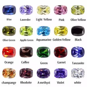 Puede incluir: Una colección de veinte piedras preciosas rectangulares de varios colores, incluyendo azul, rosa y verde. Cada piedra tiene un nombre de color diferente impreso debajo, como "Azul", "Rosa" y "Verde".
