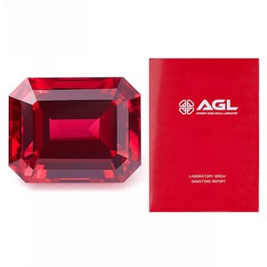 May include: A deep red, emerald-cut gemstone with a laboratory-grown gemstone report from the Antwerp Gemological Laboratory (AGL).