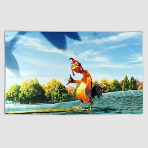 May include: A rectangular wall tapestry featuring a cartoon rooster surfing on a wave. The rooster is orange, red, and yellow, with a black tail. The background shows a blue sky with clouds, trees, and water.