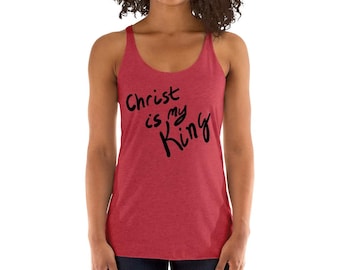 May include: Red tank top with a black graphic that says "Christ is my King" in a handwritten style.