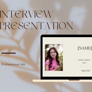 May include: A laptop screen displaying a presentation slide with the text "INTERVIEW PRESENTATION" at the top. The slide also includes a headshot of a woman in a pink dress, the text "[NAME]" and the text "Position Applied: Date: "MOTTO"".