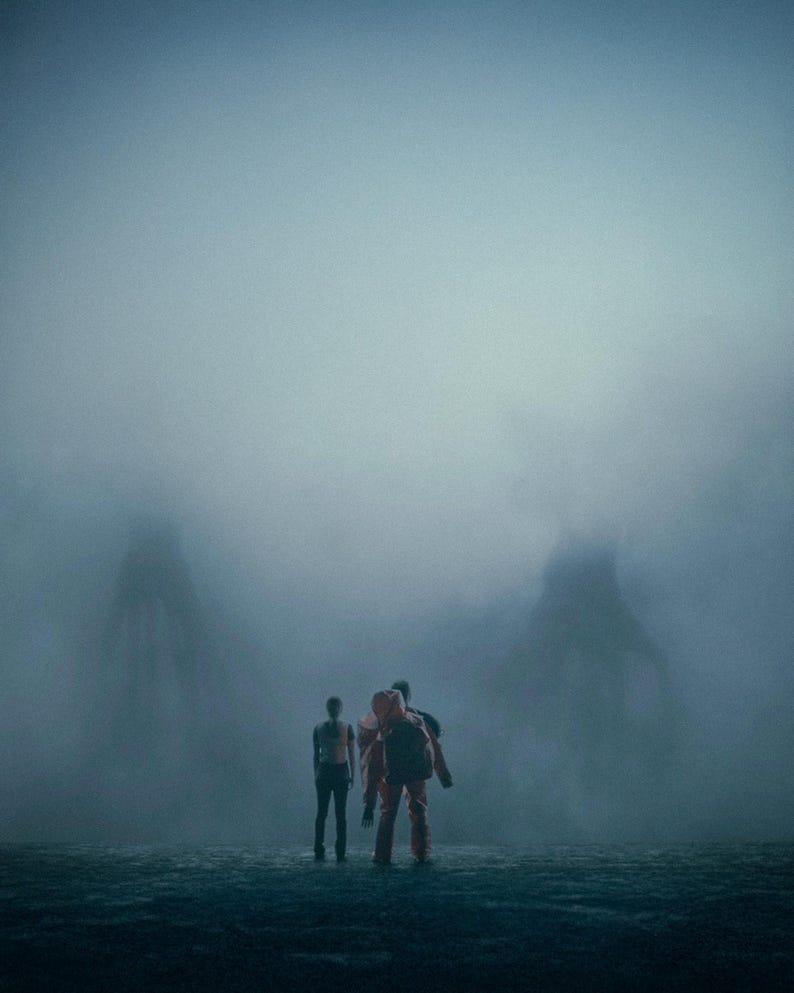 May include: Three figures in a misty environment. One person is in an orange jumpsuit and backpack, the others in dark clothing. The background shows large, shadowy forms, all shrouded in a dense fog.