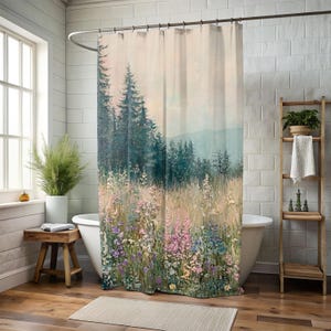 May include: A shower curtain featuring a watercolor-style landscape with a forest of pine trees in the foreground and a mountain range in the background. The forest floor is covered in a field of wildflowers in shades of pink, purple, and white.