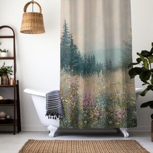 May include: A shower curtain with a watercolor-style design of a forest clearing with a field of wildflowers. The background features a hazy mountain range.
