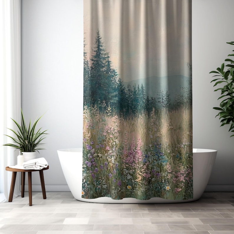 May include: A shower curtain featuring a scenic landscape with a field of wildflowers in the foreground and a forest of pine trees in the background. The sky is a soft, hazy blue.