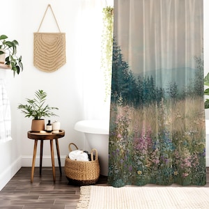 May include: A shower curtain featuring a watercolor-style landscape with a misty forest and wildflowers in shades of pink, purple, and blue.