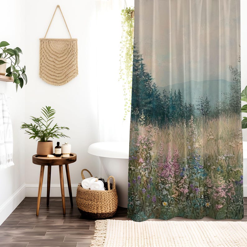 May include: A shower curtain featuring a watercolor-style landscape with a misty forest and wildflowers in shades of pink, purple, and blue.