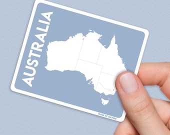 May include: A blue card with a white outline and the word "AUSTRALIA" printed vertically in white. A white outline of the continent of Australia is shown on the card. The text "FLASH OF CULTURE" is printed in white at the bottom of the card.