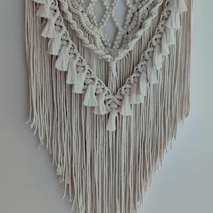 Macrame wall hanging with pompoms. Valentine&#39;s Day gift idea