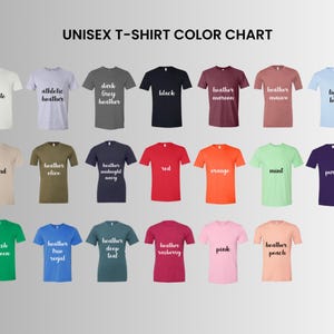 May include: A color chart displaying a variety of unisex t-shirt colors. The chart includes shades like white, black, red, orange, and purple, with text labels such as "athletic heather" and "mint". The text "UNISEX T-SHIRT COLOR CHART" is at the top.