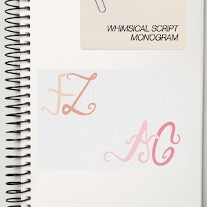 May include: A spiral-bound notebook with a cream-colored cover featuring a paperclip and the text "WHIMSICAL SCRIPT MONOGRAM." The notebook displays two monogram designs: "FZ" in peach and "AC" in pink. Copyright 2025 The Nearly Wed.