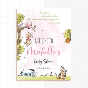 May include: A Winnie the Pooh themed baby shower invitation with a pink watercolour background. The invitation features Winnie the Pooh holding a pink balloon, Piglet, and a beehive. The text reads "Welcome to Michelle's Baby Shower 06.24.20xx".