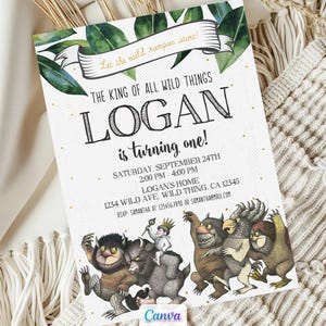 May include: A printed invitation for a first birthday party. The invitation features the text "The King of All Wild Things" and "Logan is turning one!" with illustrations of whimsical creatures. The invitation includes event details.