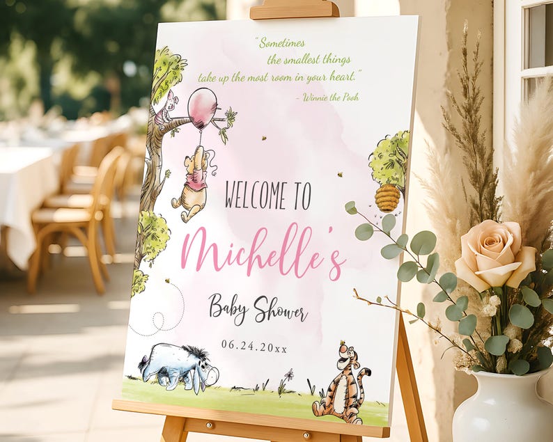 Girl baby shower welcome sign with Winnie the Pooh holding a pink balloon, Piglet in a tree, and Tigger and Eeyore on the grass; editable and printable design in soft pastel tones, displayed on an easel for outdoor decoration.