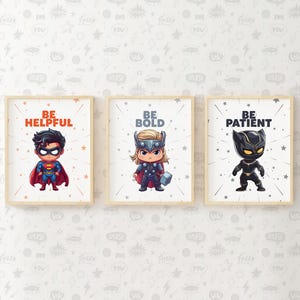 May include: Three framed prints with motivational messages and cartoon superhero characters. The prints feature the text "Be Helpful" with a cartoon Superman, "Be Bold" with a cartoon Thor, and "Be Patient" with a cartoon Black Panther.