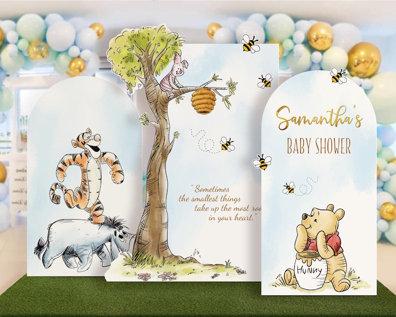 Whimsical Winnie the Pooh baby shower cutout backdrop featuring Tigger, Eeyore, Piglet, and Pooh Bear with pastel balloon arch in the background. Customizable printable panel set includes 'Sometimes the smallest things take up the most room in your heart' message and name personalization for a themed party decoration.
