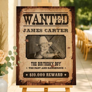 Western-style wanted poster birthday sign with rustic wood background and vintage paper effect, featuring customizable photo and cowboy-themed text. Perfect for wild west birthday parties and cowboy decorations.