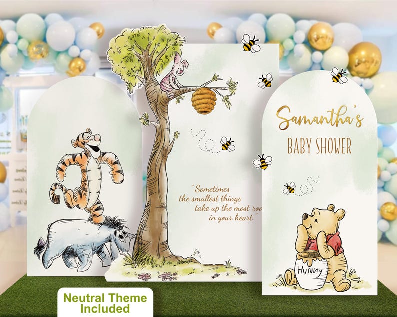 Gender neutral Winnie the Pooh baby shower backdrop set featuring soft neutral tones. Includes custom name panel, playful character cutouts of Tigger, Eeyore, and Piglet on a tree with buzzing bees and the quote 'A little hunny is on the way'. Perfect for a unisex baby shower decoration.