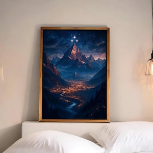 May include: A framed print of a mountain range with a town at the base, under a starry night sky.