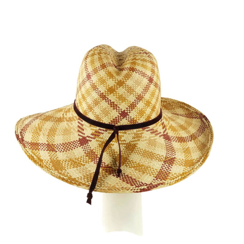 May include: A wide-brimmed straw hat with a brown plaid pattern and a brown velvet ribbon.