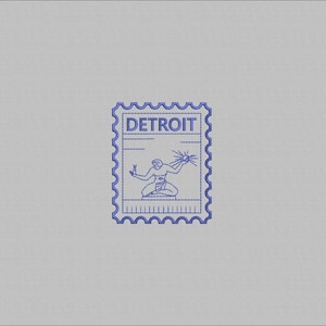 May include: Blue embroidered stamp with the word "DETROIT" at the top. The stamp features a kneeling figure holding a sunburst. The stamp has a decorative border and is set against a grey background.