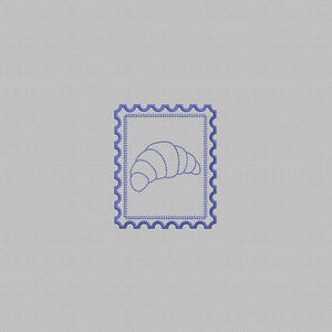 May include: A blue embroidered postage stamp design featuring a croissant. The stamp has a scalloped border and is set against a light gray background. The croissant is depicted with simple, stitched lines.