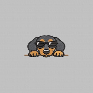 May include: Embroidered image of a dachshund wearing sunglasses. The dog has black and tan fur, with black sunglasses. The dog's paws are resting on a thin, brown line. The background is a solid, light gray color.