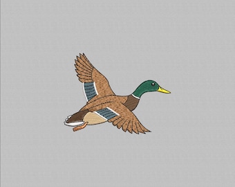 May include: An embroidered image of a mallard duck in flight. The duck features brown, green, and blue feathers, with a yellow beak. The background is a solid light gray.