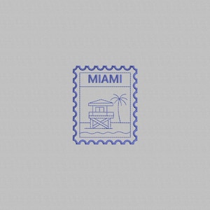 May include: A blue embroidered stamp design featuring the word "MIAMI" at the top. The stamp depicts a lifeguard tower, palm tree, and ocean waves. The stamp has a scalloped edge and is set against a light gray background.