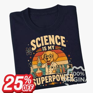 May include: A navy blue t-shirt featuring a graphic of a golden puppy wearing glasses and a lab coat, surrounded by laboratory glassware. The text reads "SCIENCE IS MY SUPERPOWER" over a sunset background with stars and an atom symbol.