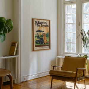 May include: A vintage movie poster with a brown wooden frame. The poster is for a movie called "Golden Day on the Greens" and features a cartoon dog driving a golf cart.