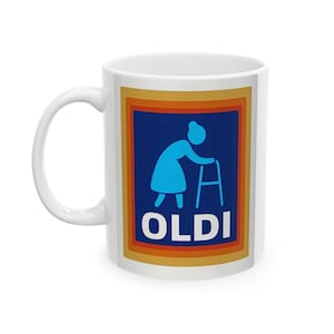 Puede incluir: Taza de cerámica blanca con un gráfico azul y naranja. El gráfico presenta una silueta azul de una persona usando un andador, con la palabra "OLDI" en letras blancas. La taza tiene un asa blanca.