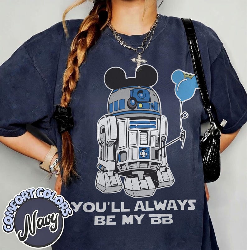May include: Navy blue Comfort Colors t-shirt featuring a cartoon R2-D2 character with Mickey Mouse ears holding a blue balloon. The text "YOU'LL ALWAYS BE MY BB" is printed below the graphic.