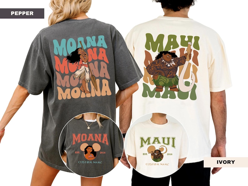 Puede incluir: Dos camisetas, una gris y otra crema, con gr&aacute;ficos de personajes. La camiseta gris tiene "MOANA" en texto colorido con una ilustraci&oacute;n de personaje. La camiseta crema muestra "MAUI" con una ilustraci&oacute;n de personaje. Ambas camisetas tienen texto adicional.