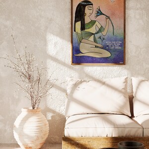 May include: A watercolor illustration of a woman in a yellow robe holding a blue lotus flower. The background is a gradient of orange, pink, and blue. The text reads "Ancient scent of blue, whispers the lotus into my heart, as a soul's embrace."