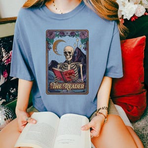 The Reader Tarot Card Shirt, Comfort colors,Skeleton Reading Shirt, Unisex Tarot Card Shirt, Book Lover Gift, Bookish Gift, Tarot Lover Gift