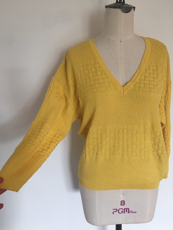 Courrèges, Vintage 1970s/80s Courreges Paris yellow pullover sweater. V-neck. Mixed basketweave knit. Mustard yellow. 100% cotton. Made in France.