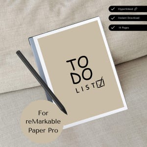 以下が含まれることがあります： ベージュのデジタルノートに、黒い「TO DO LIST」というタイトルとチェックマークが書かれています。ノートはベージュの布地に置かれ、横に黒いスタイラスがあります。ノートの下の円の中に「For remarkable Paper Pro」というテキストが表示されています。
